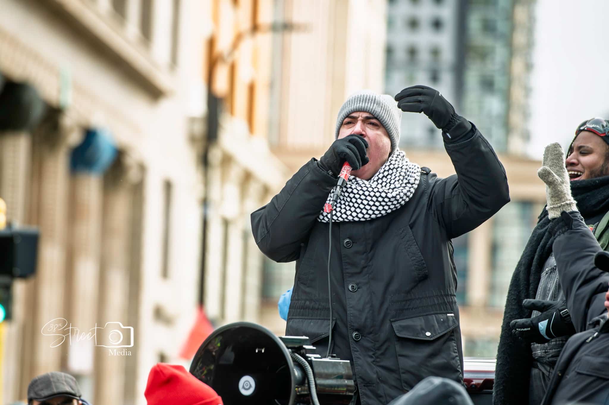 protestor speaking in microphone
